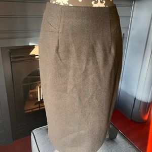 BLack wool like skirt. Lined. Fitted. I believe it says size 5!